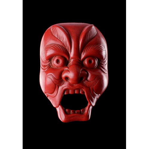 A Very Fine and Unusual Carved Red Lacquer Netsuke